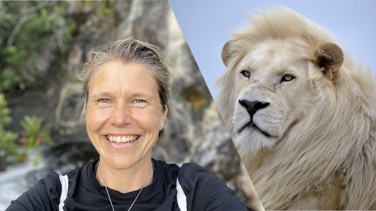 Cathrine LionHeart with Jubatus, a white lion — courage, compassion, and wild wisdom